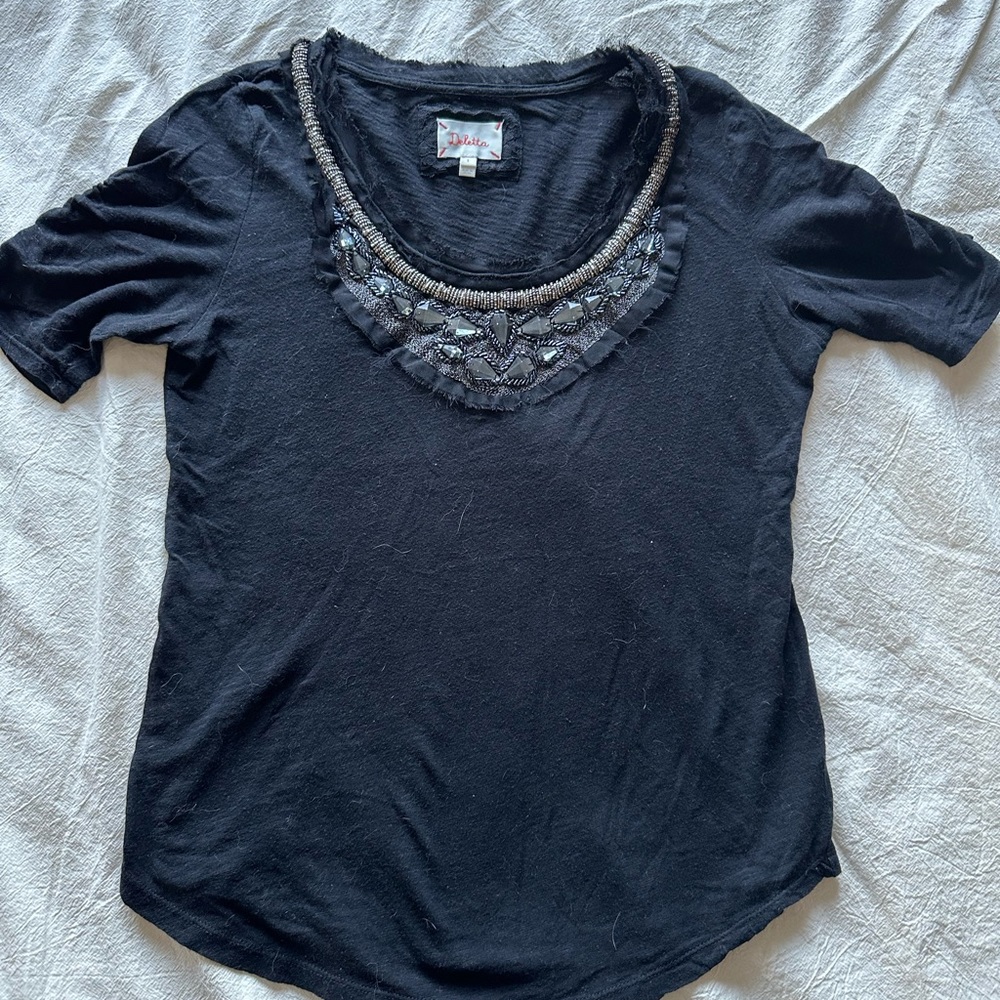 Black shirt with beaded detail from Anthropologie